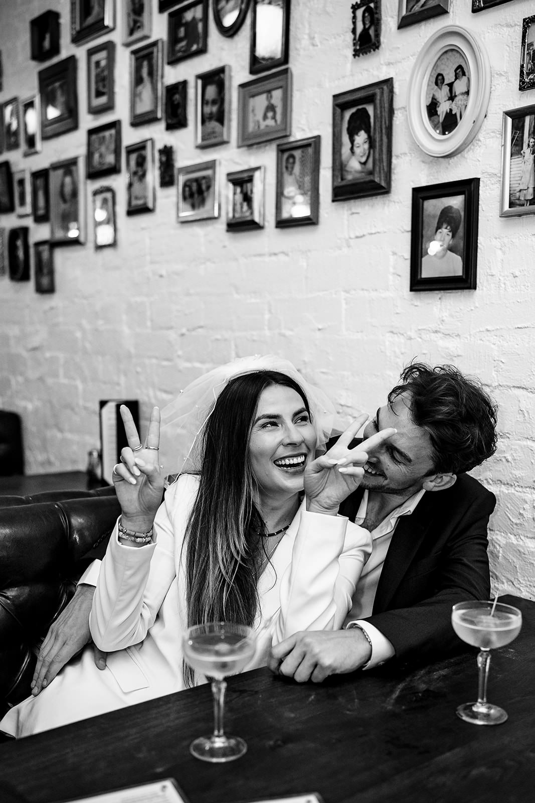 fun candid moment of newlyweds laughing at a bar during Las Vegas elopement