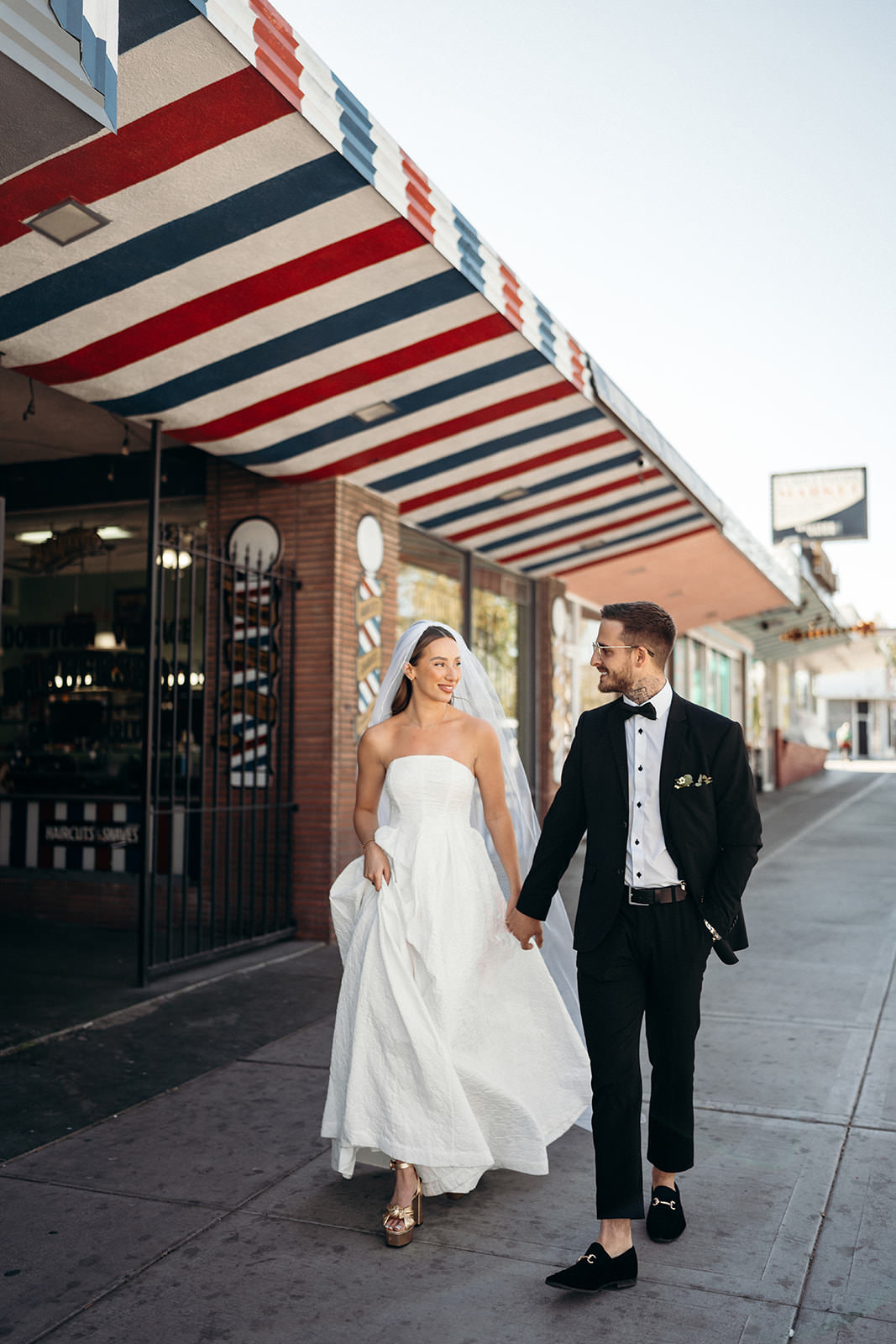 wedding couple walking in downtown Las Vegas during daytime elopement