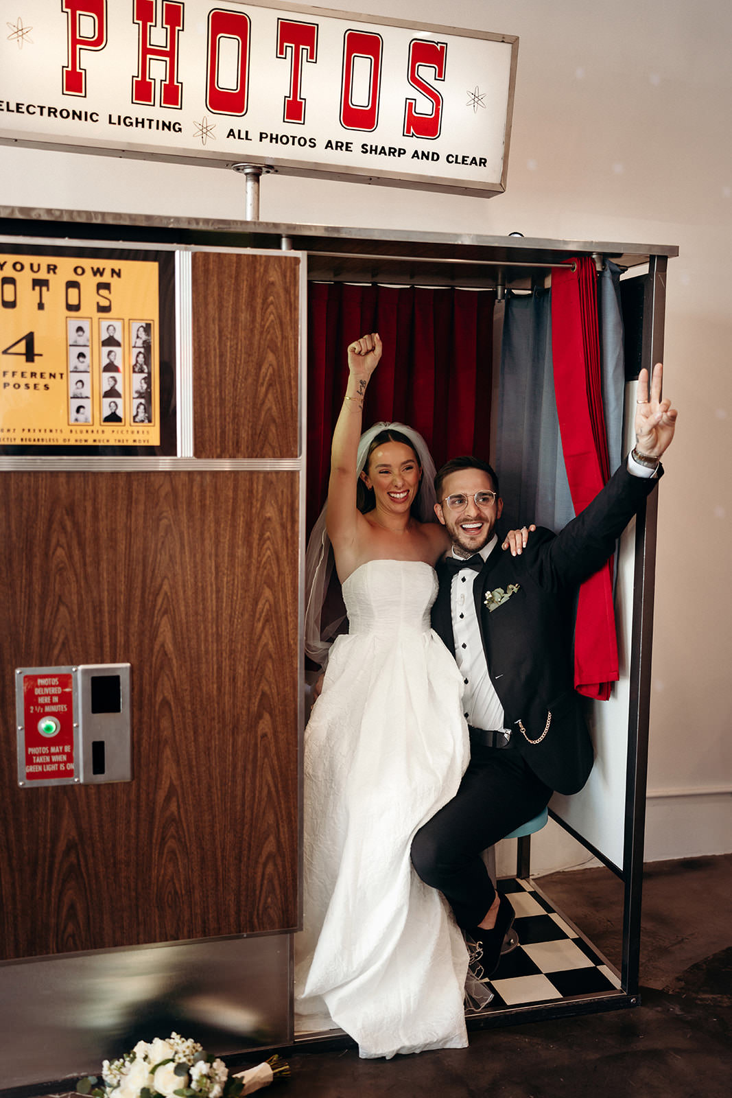 wedding couple celebrating in photo booth at Sure Thing Chapel Las Vegas