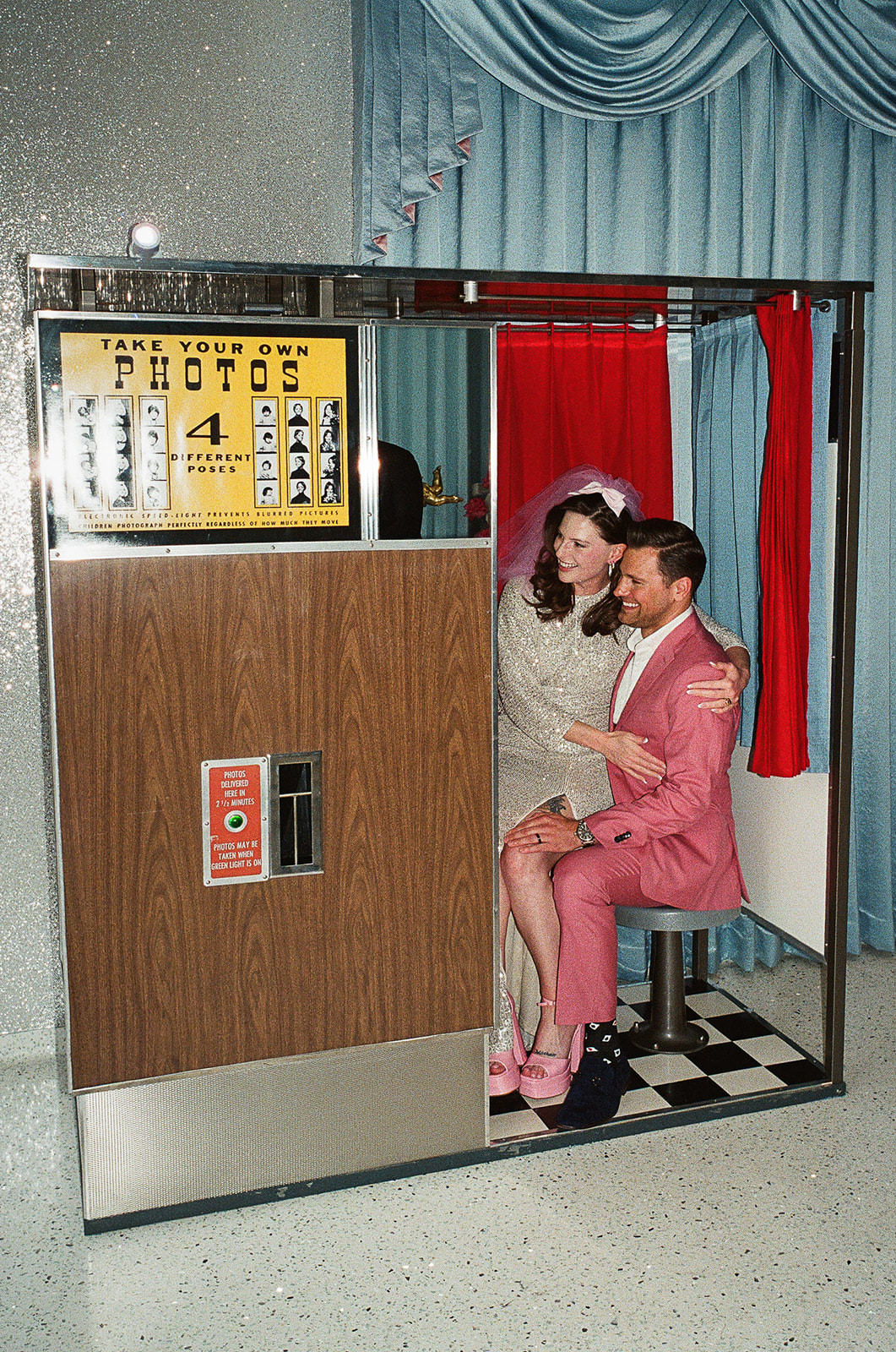 wedding couple using vintage photobooth at Sure Thing Chapel Las Vegas elopement