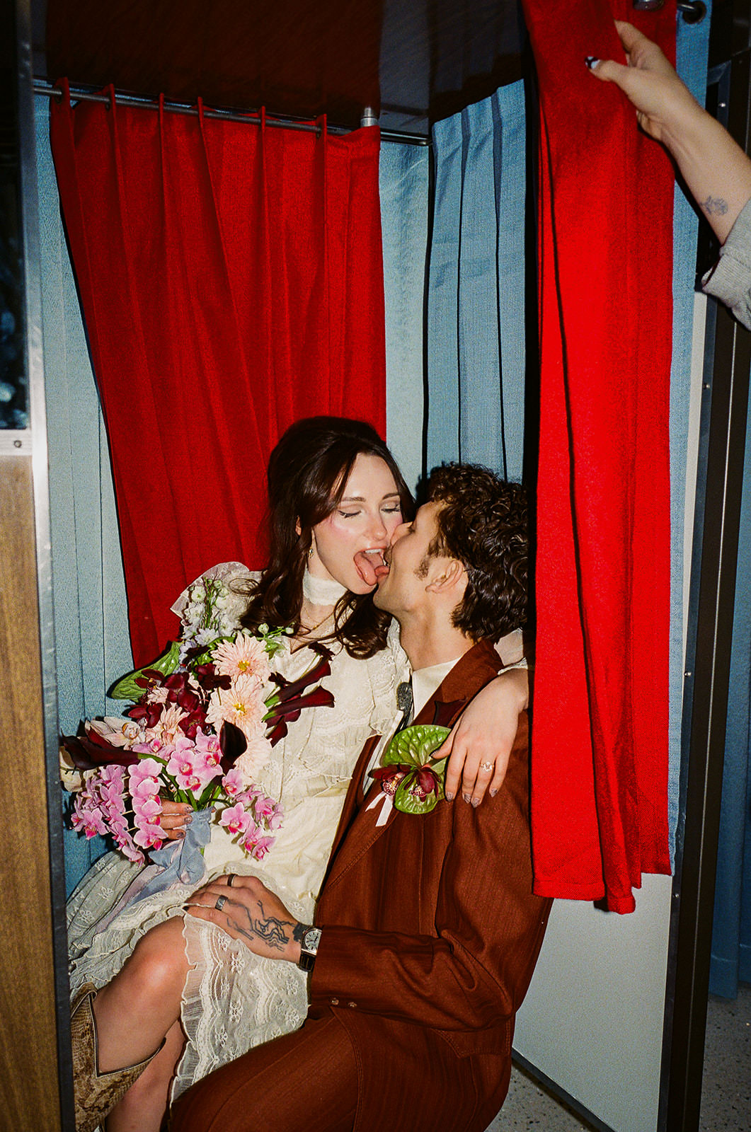 playful couple in photo booth at Sure Thing Too Chapel Las Vegas elopement