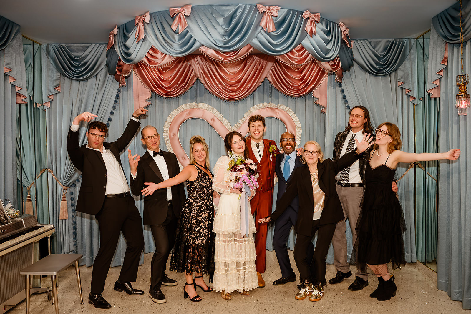 wedding group photo with guests at Sure Thing Chapel Las Vegas heart altar celebration